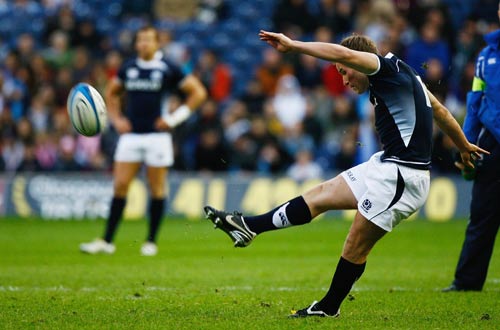 Fly-half Phil Godman kicks a penalty for Scotland