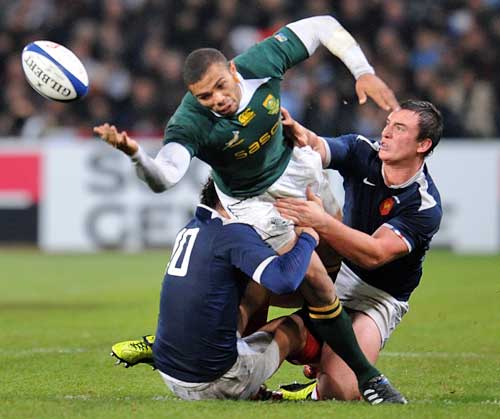 South Africa's Bryan Habana is tackled by the France defence