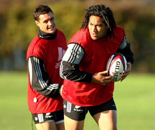 New Zealand centre Ma'a Nonu runs with the ball as fly-half Dan Carter looks on 