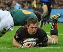 Saracens' Ernst Joubert dives in to score a try