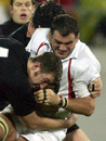 England captain Martin Johnson is tackled by New Zealand's Chris Jack