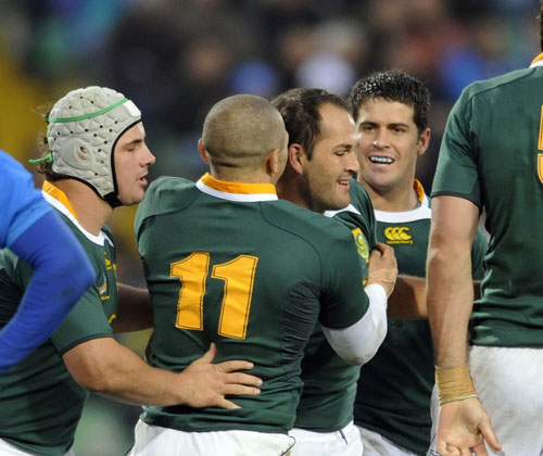 South Africa captain Fourie du Preez celebrates with his try with his team-mates