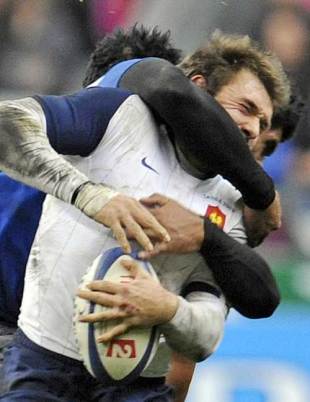 France's Vincent Clerc is tackled by Samoa's Misioka Timoteo, France v Samoa, Stade de France, Paris, France, November 21, 2009