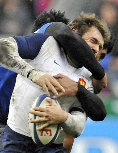 France's Vincent Clerc is tackled by Samoa's Misioka Timoteo 