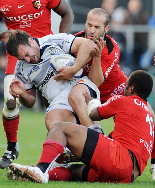 Castres hooker Mathieu Bonello is swallowed up by the Toulouse defence