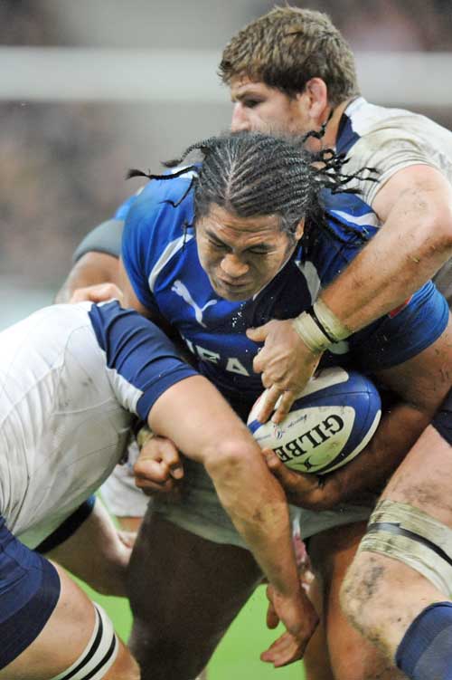 Samoa's Henry Tuilagi is tackled by the France defence