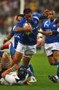 Samoa's Lucky Mulipola is felled by the France defence