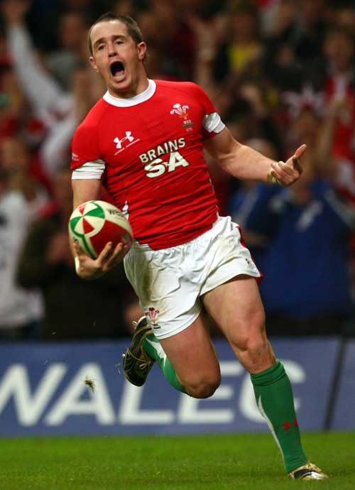 Wales' Shane Williams celebrates scoring a try
