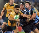 Australia's Tyrone Smith takes on Blues' defence