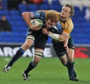 The Blues' Paul Tito is tackled by Australia's Ryan Cross