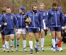 France locks Sebastien Chabal and Lionel Nallet talk as they arrive at training
