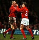 Wales fly-half Neil Jenkins high-fives his replacement, Arwel Thomas