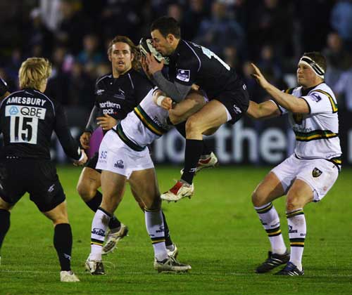 Newcastle scrum-half Micky Young claims a high ball
