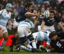 Scotland lock Nathan Hines off-loads in the tackle