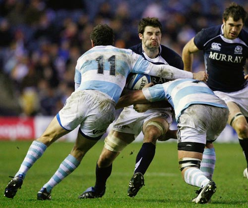 Scotland's Johnnie Beattie is halted by the Pumas defence