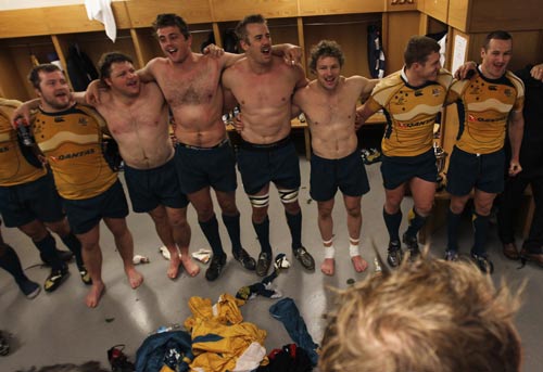 Australia's players celebrate in their dressing room after the game
