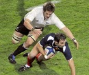 New Zealand's Richie McCaw tackles France's Morgan Parra