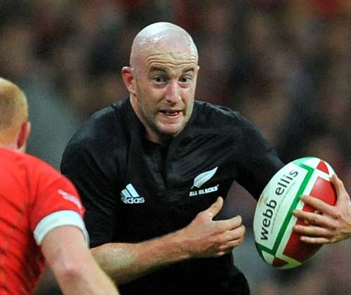 New Zealand scrum-half Brendon Leonard takes on the Welsh defence