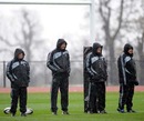 The New Zealand coaching team brave the elements