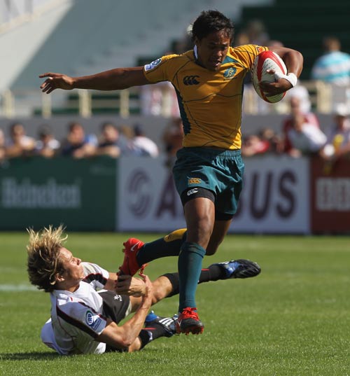 Australia's Brackin Karauria-Henry breaks a tackle to score