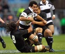 Barbarians flanker George Smith is shackled by the All Blacks' defence