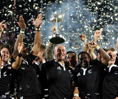 New Zealand celebrate victory at the Dubai Sevens
