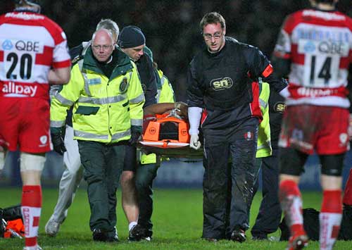 Gloucester's Akapusi Qera is stretchered from the field