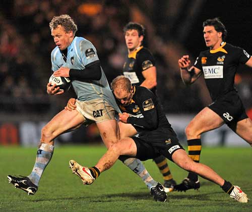Leicester's Scott Hamilton is tackled by Wasps' Joe Simpson