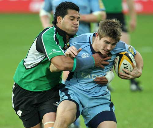 Cardiff Blues' Richard Mustoe is tackled by Connacht's Niva T'auso