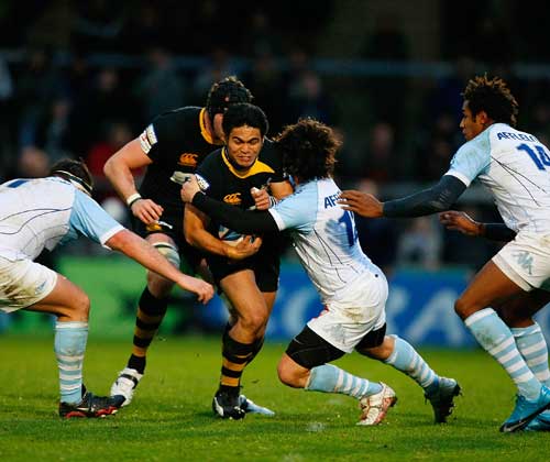 Wasps wing David Lemi is caught by a Bayonne tackler