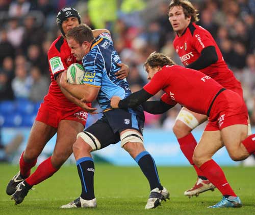 Cardiff Blues' Xavier Rush is shackled by the Toulouse defence
