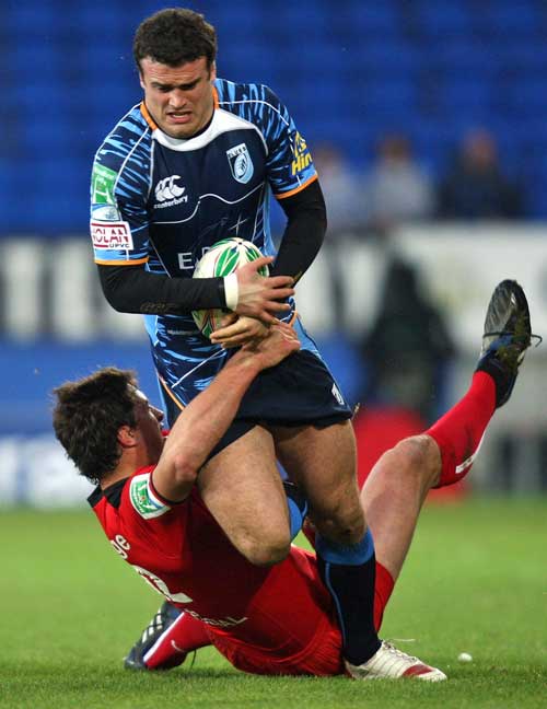 Cardiff Blues centre Jamie Roberts rides a tackle
