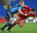 Toulouse's Louis Picamoles is tackled by Cardiff Blues' Martyn Williams