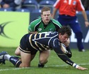 Worcester back-row Tom Wood dives in to score