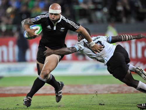 New Zealand's DJ Forbes stretches the Fiji defence