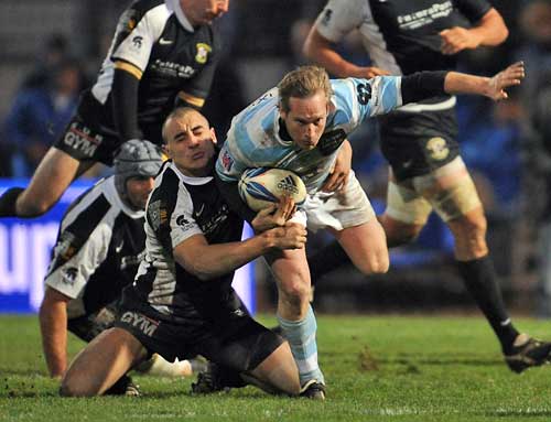 Rugby Roma's hooker Tommaso D'Apice tackles Racing Metro's Brent Ward