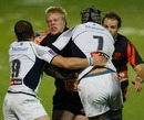 Saracens flanker Don Barrell is smashed by the Castres defence