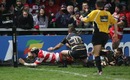 Gloucester lock Dave Attwood dives in to score a late try
