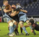 Edinburgh's Roddy Grant is tackled by the Cardiff Blues defence