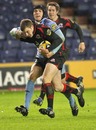 Edinburgh's Rory Hutton and Cardiff Blues' Tom James battle for the ball 
