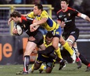 Toulouse winger Vincent Clerc is shackled by the Clermont defence