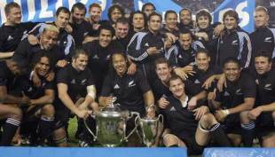 The All Blacks celebrate with the 2005 Tri Nations trophy and the Bledisloe Cup, New Zealand v Australia, Tri Nations, Eden Park, September 3 2005.