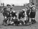 Newport and Bridgend players scrabble for the ball c.1939