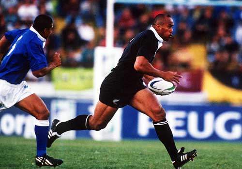 Jonah Lomu runs with the ball during the Sevens World Cup 