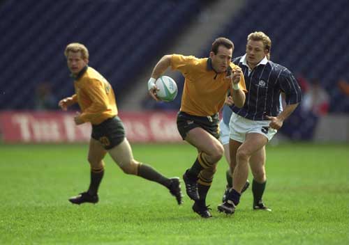 David Campese runs with the ball