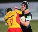 Glasgow's Kelly Brown fends off the Dragons' Danny Lee