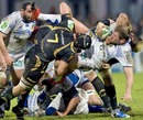 The Ospreys' defence gang up on Clermont's Elvis Vermeulen
