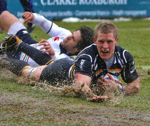 Worcester's Jake Abbott slides in to score a try