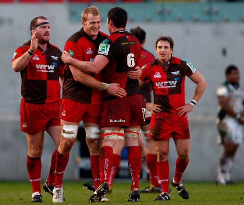 Scarlets flanker Rob McCusker is congratulated at the final whistle