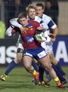 Perpignan's Jean-Philippe Grandclaude is tackled by Treviso's Simon Picone